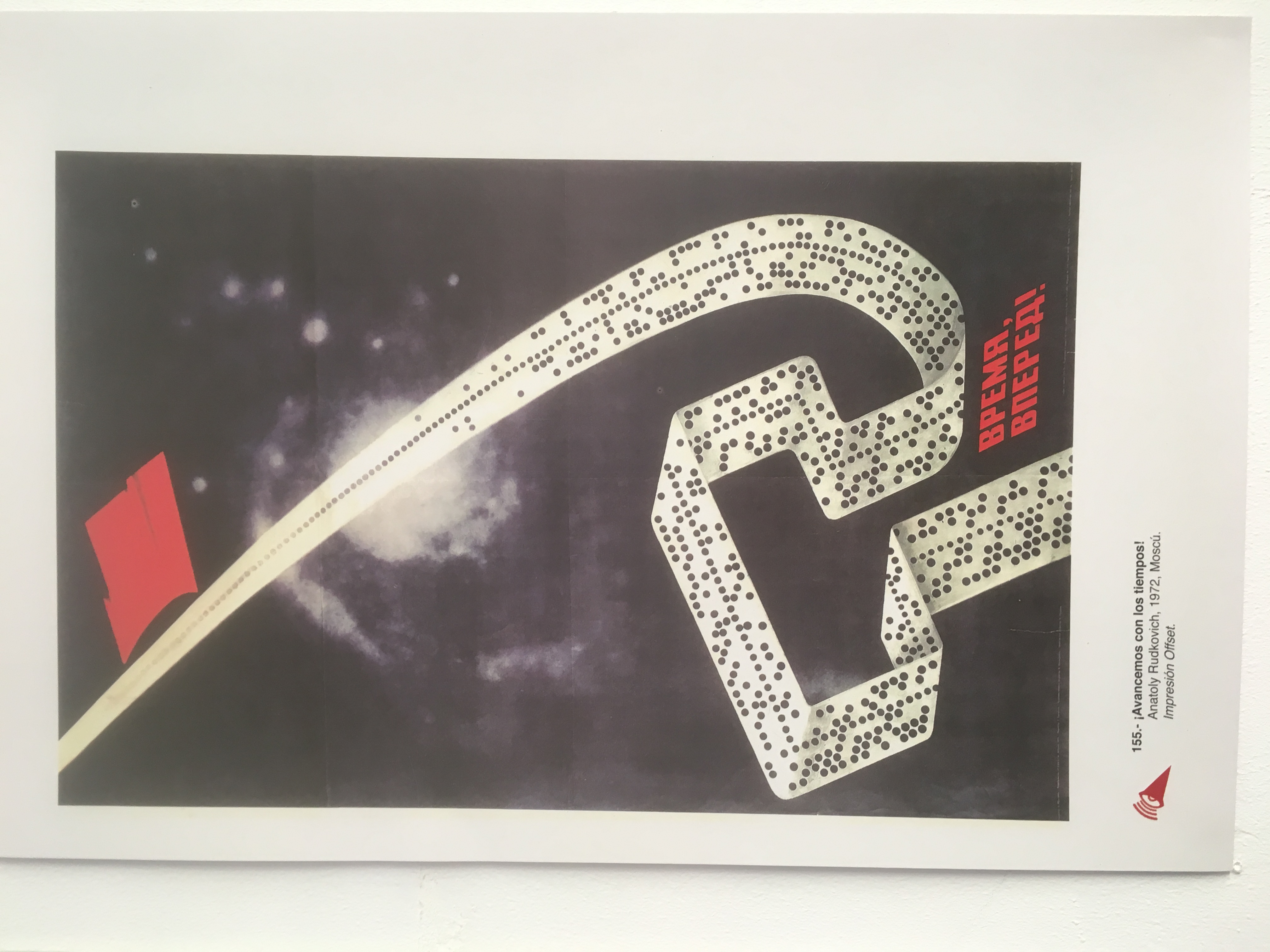 Russian poster depicting hammer and sickle in computer tape