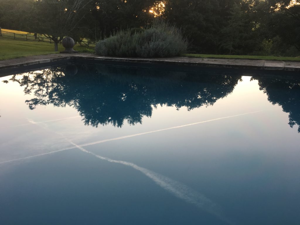 Sunset picks out air trails crossing rural France