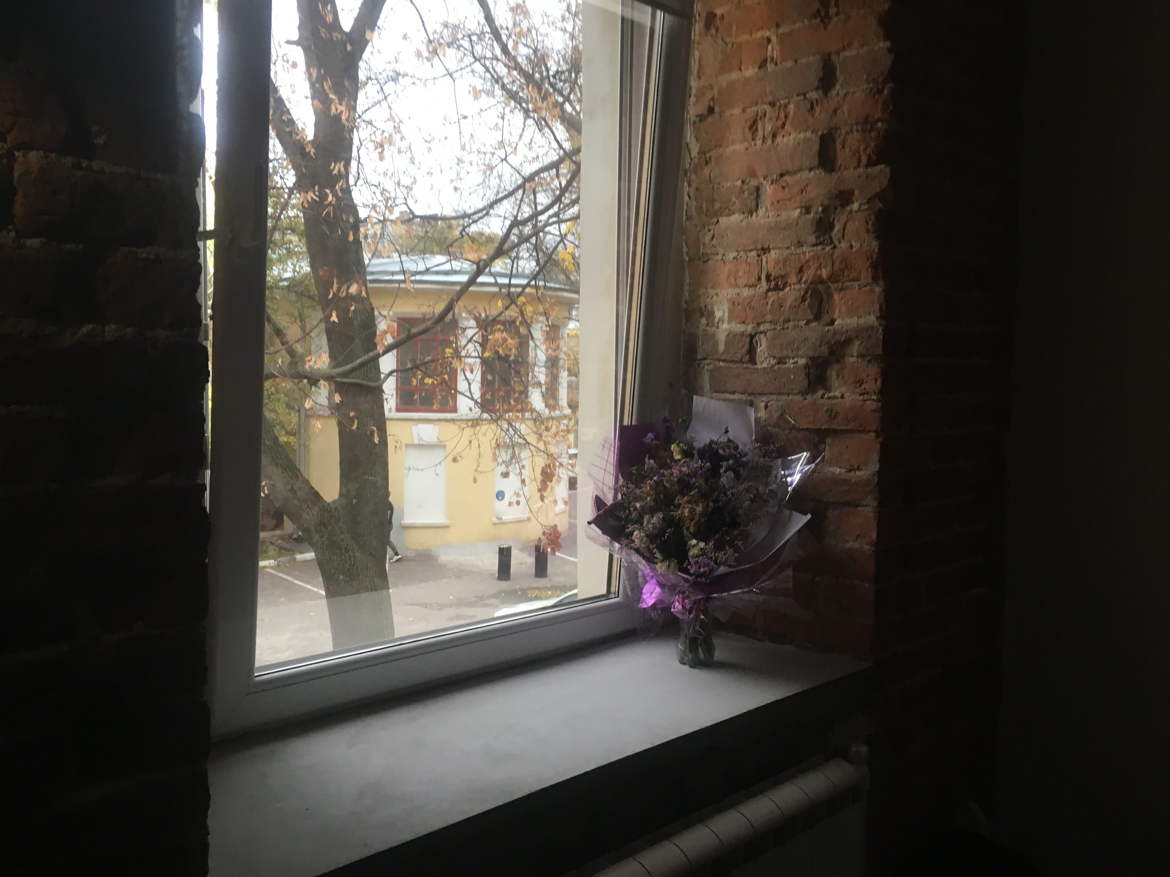 Sad dried flowers in hostel. Which girl do they belong to? Can you see him leaving in the background?