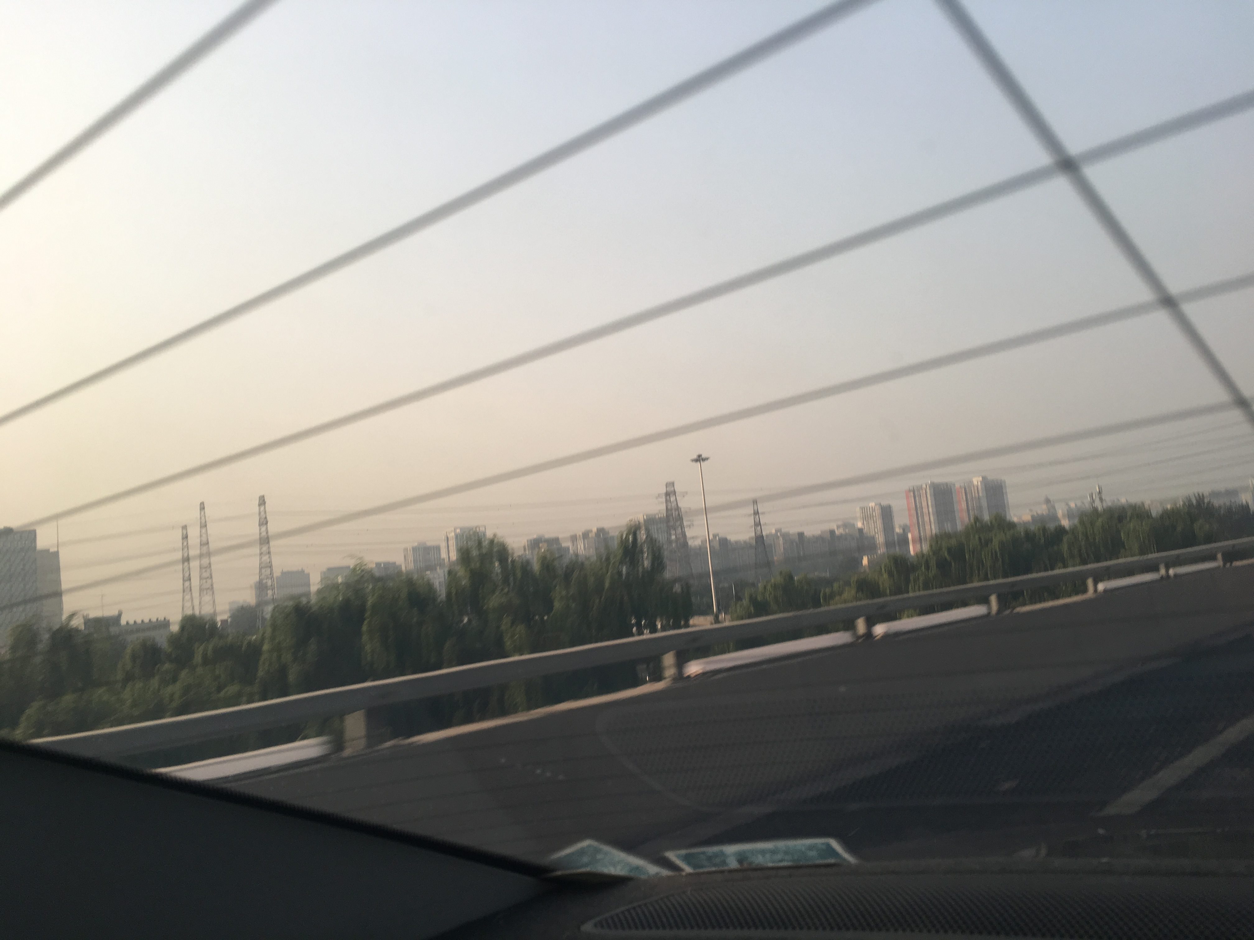 Driving out of Beijing, looking back at the fringe of the city