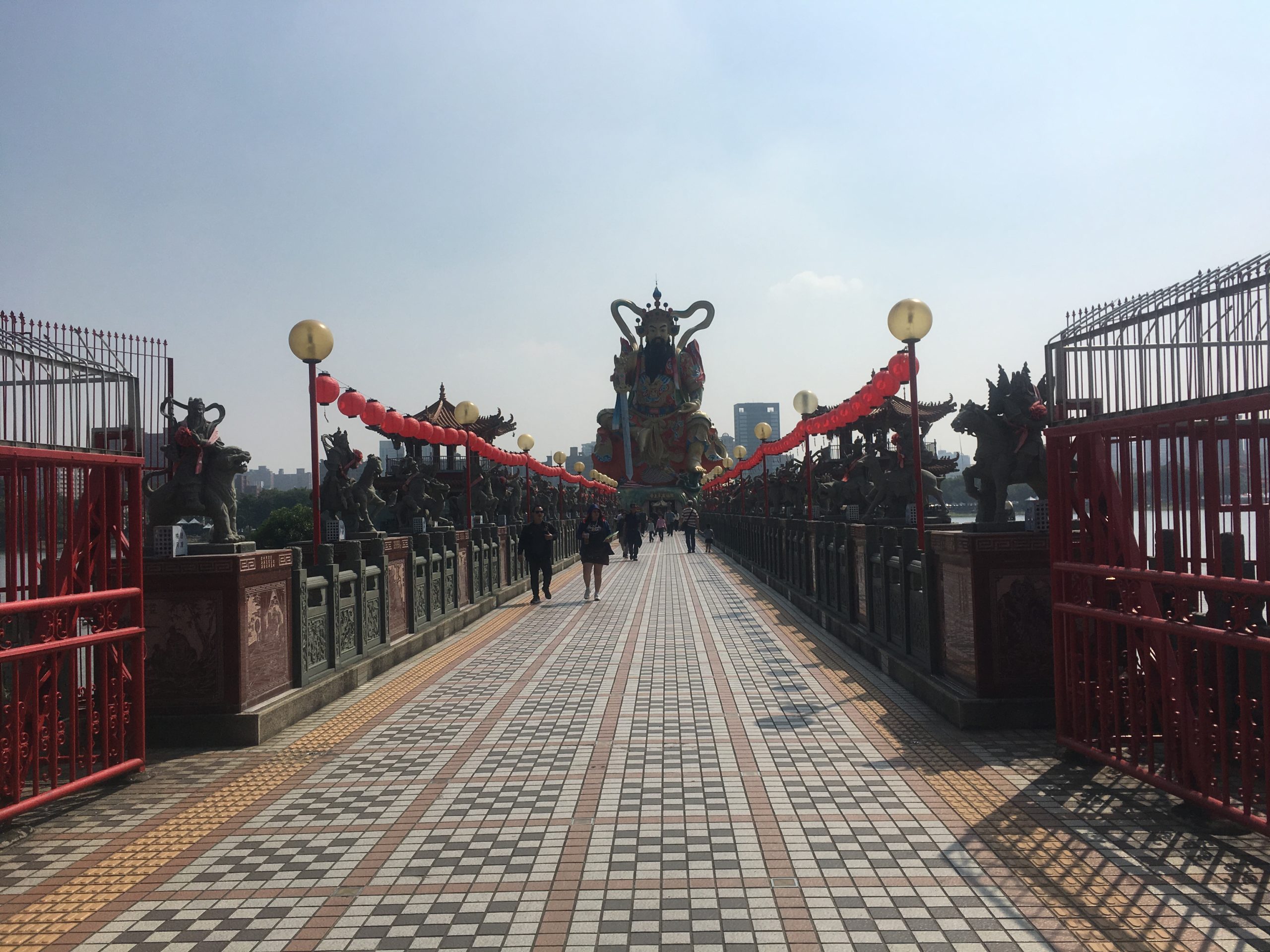 The bridge to this temple is guarded by a pantheon of Gods riding different animals