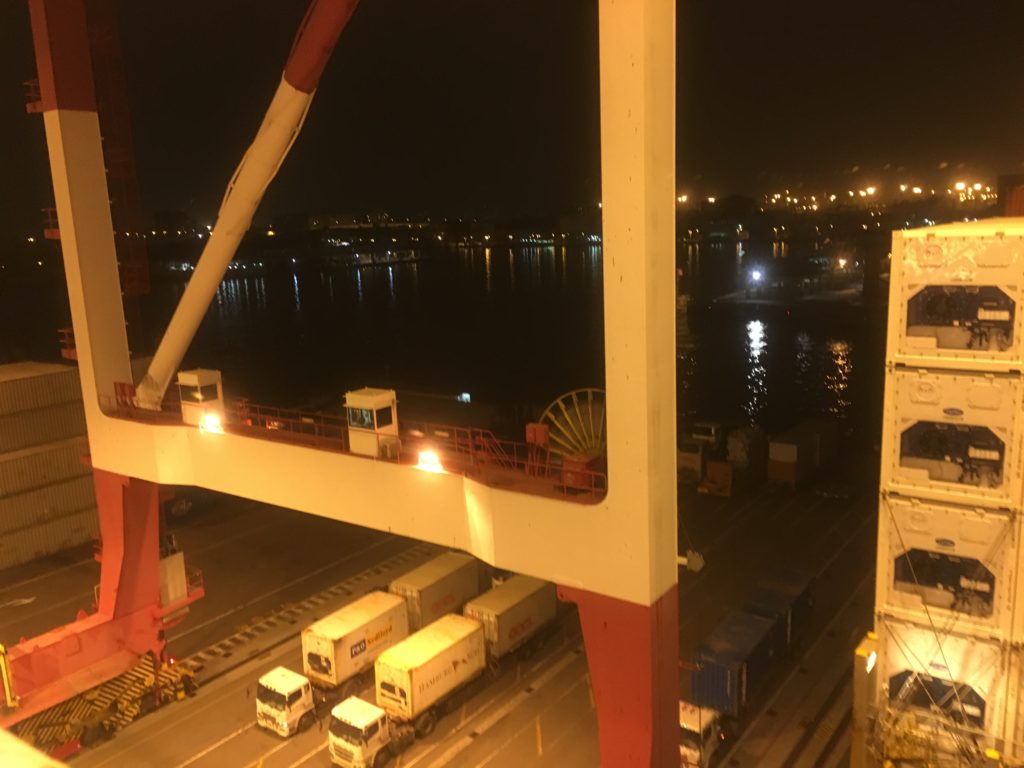 Trucks line up in order to wait for the spreader to take a load off