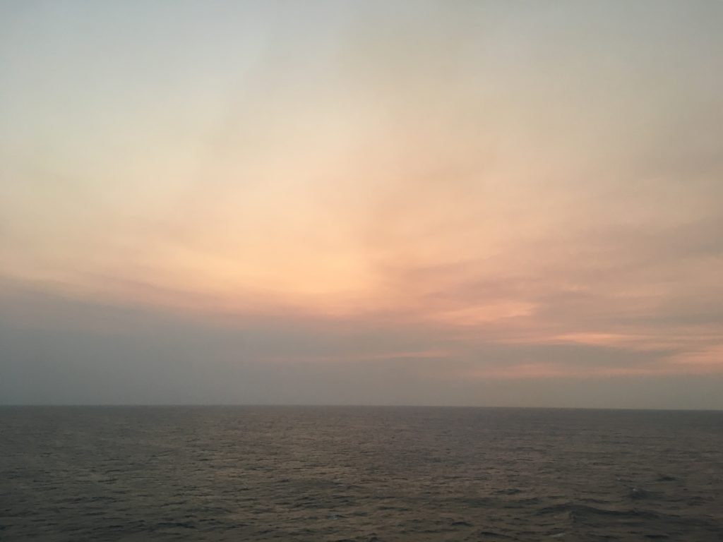 Sun gone smoke remains Coral Sea