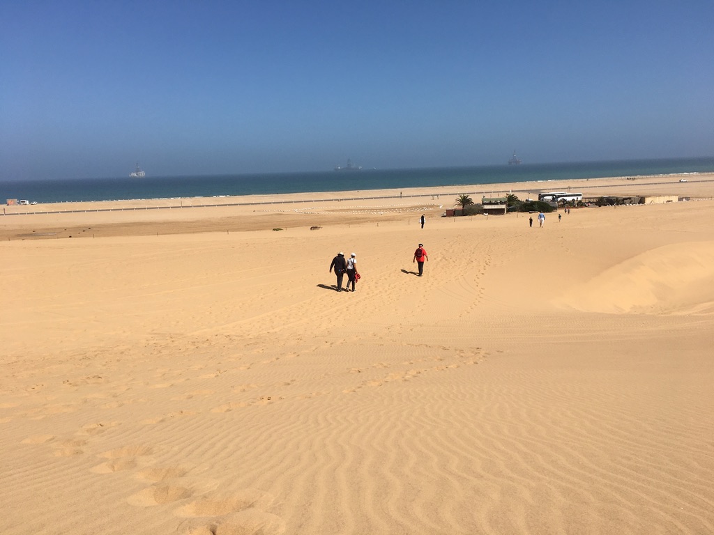 Walvis Bay - from dune to beach - note tourist bus